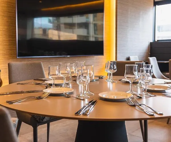 Отель Adonis Plaza